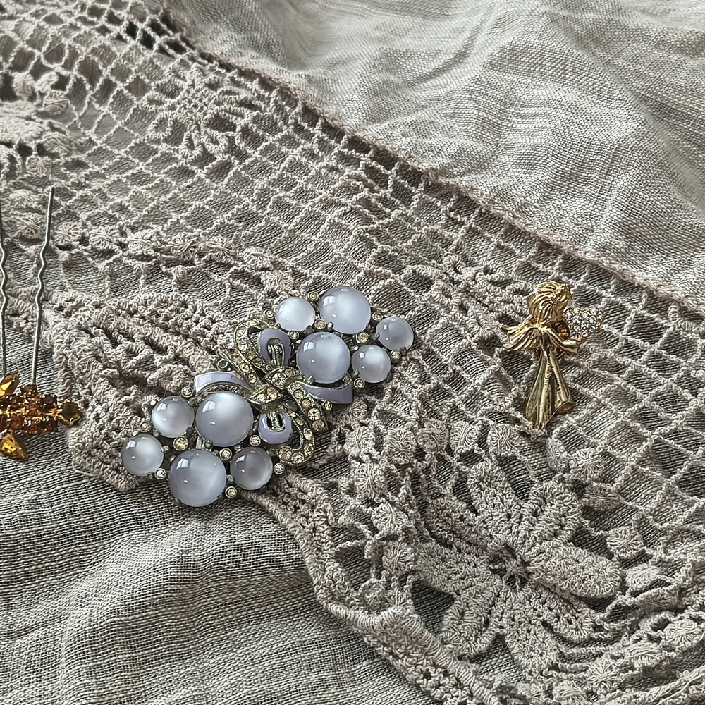 Delicate White Glass Cabochon Brooch with Gold Accents
